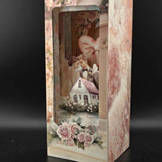 Bridal home book nook paper craft with wedding celebration scene, displayed inside a bookshelf