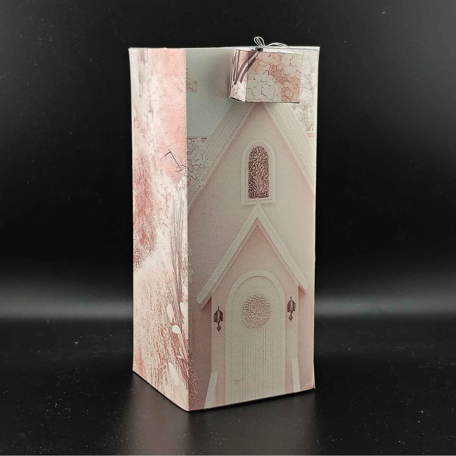 Bridal home book nook paper craft with wedding celebration scene, displayed inside a bookshelf