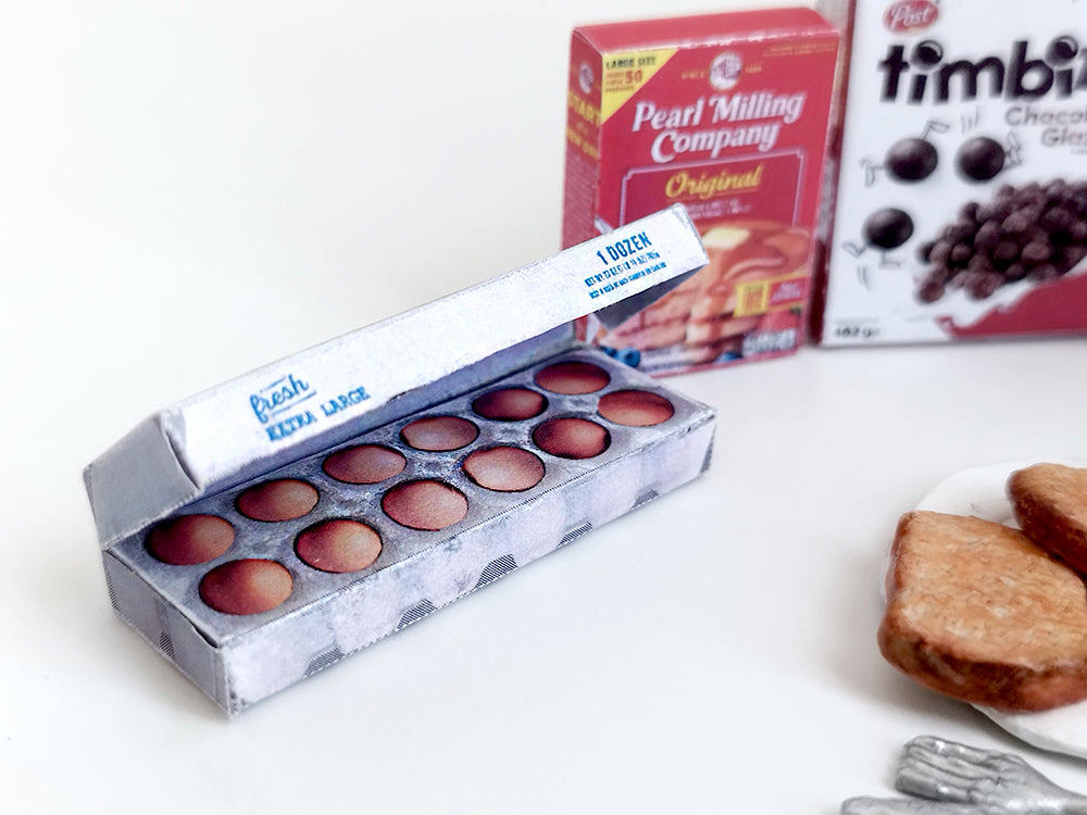 Start your doll’s day with this 1:6 scale 7-piece Miniature Breakfast Printable set! Featuring DIY mini boxes of milk, bread, pancakes, eggs, orange juice, cereal, and butter, it’s a must-have for miniature lovers and dollhouse enthusiasts.