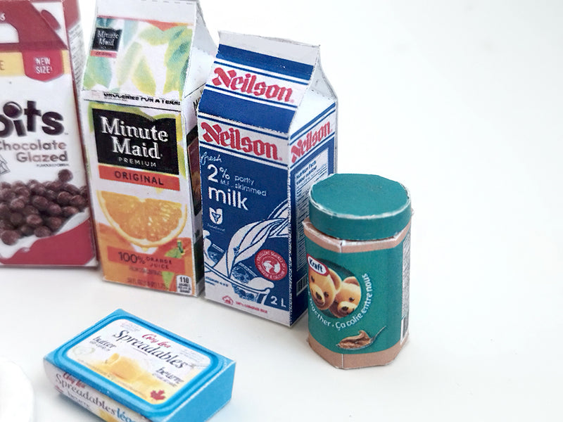 Start your doll’s day with this 1:6 scale 7-piece Miniature Breakfast Printable set! Featuring DIY mini boxes of milk, bread, pancakes, eggs, orange juice, cereal, and butter, it’s a must-have for miniature lovers and dollhouse enthusiasts.