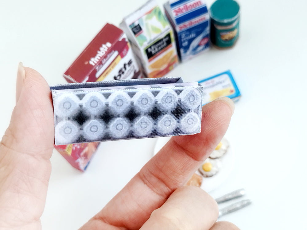 Start your doll’s day with this 1:6 scale 7-piece Miniature Breakfast Printable set! Featuring DIY mini boxes of milk, bread, pancakes, eggs, orange juice, cereal, and butter, it’s a must-have for miniature lovers and dollhouse enthusiasts.