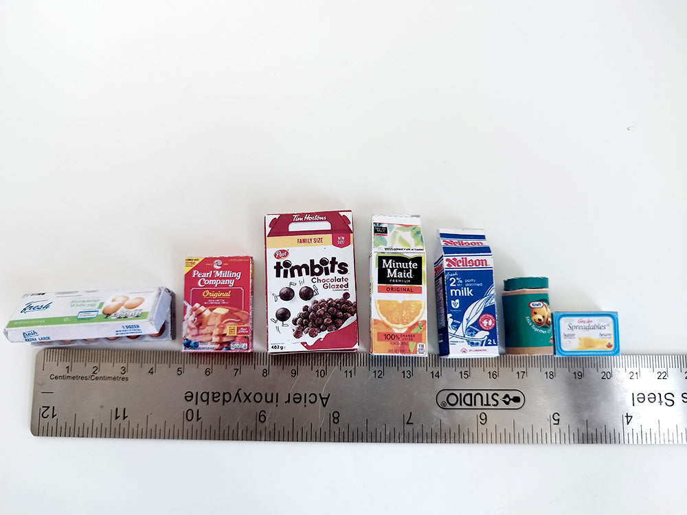 Start your doll’s day with this 1:6 scale 7-piece Miniature Breakfast Printable set! Featuring DIY mini boxes of milk, bread, pancakes, eggs, orange juice, cereal, and butter, it’s a must-have for miniature lovers and dollhouse enthusiasts.
