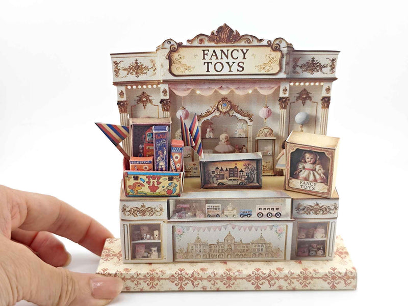 Vintage toy shop stand with miniature doll, robot, car, and fireworks, designed for collectible or dollhouse display