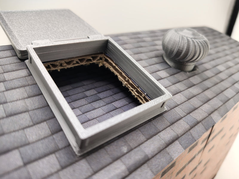 The most compelling miniature scenes rely on interactive, functional details that mirror the real world. This artist-crafted roof hatch features a fully working hinge design, allowing the textured protective lid to swing open or closed.