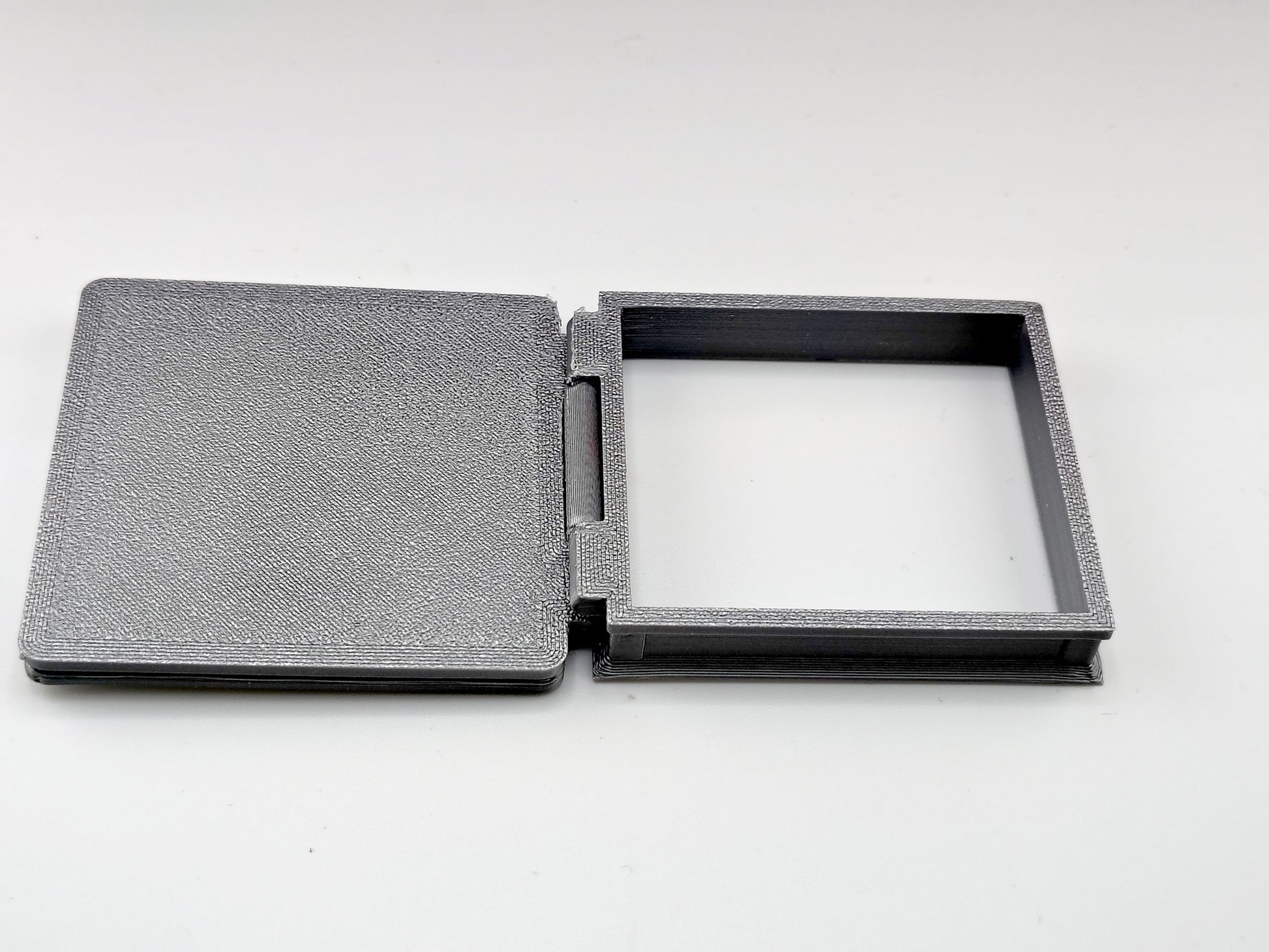 The most compelling miniature scenes rely on interactive, functional details that mirror the real world. This artist-crafted roof hatch features a fully working hinge design, allowing the textured protective lid to swing open or closed.
