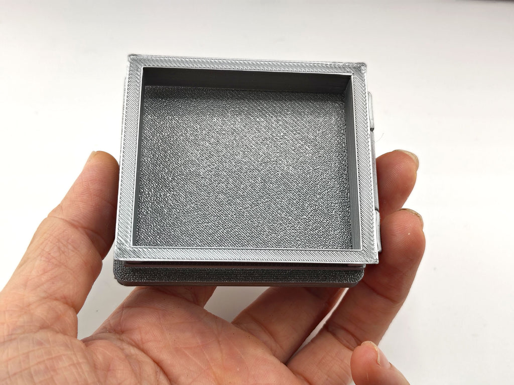 The most compelling miniature scenes rely on interactive, functional details that mirror the real world. This artist-crafted roof hatch features a fully working hinge design, allowing the textured protective lid to swing open or closed.