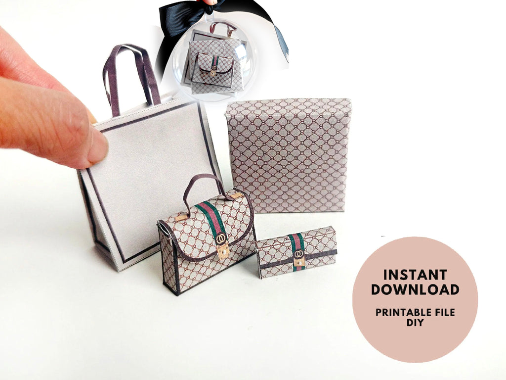 A 1:6 scale printable dollhouse set featuring four luxury brand-inspired brown shopping bags, a purse, and boxes, designed for department store or luxury home decor dioramas, ideal as yearly ornaments for miniature scenes.