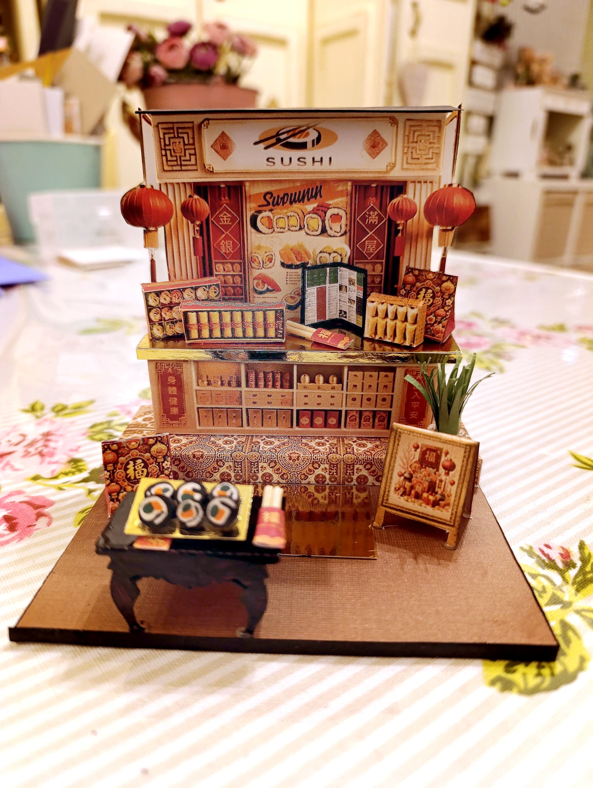 A 3D-printable STL file of a 1:12 scale Chinese New Year Lunar Fortune Cat stand DIY kit, featuring a detailed fortune cat on a stand for a dollhouse festive display

