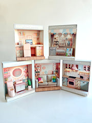 Five pastel paper room boxes: study room, baby sleep room, bathroom, living room and kitchen