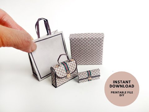 A 1:6 scale printable dollhouse set featuring four luxury brand-inspired brown shopping bags, a purse, and boxes, designed for department store or luxury home decor dioramas, ideal as yearly ornaments for miniature scenes.